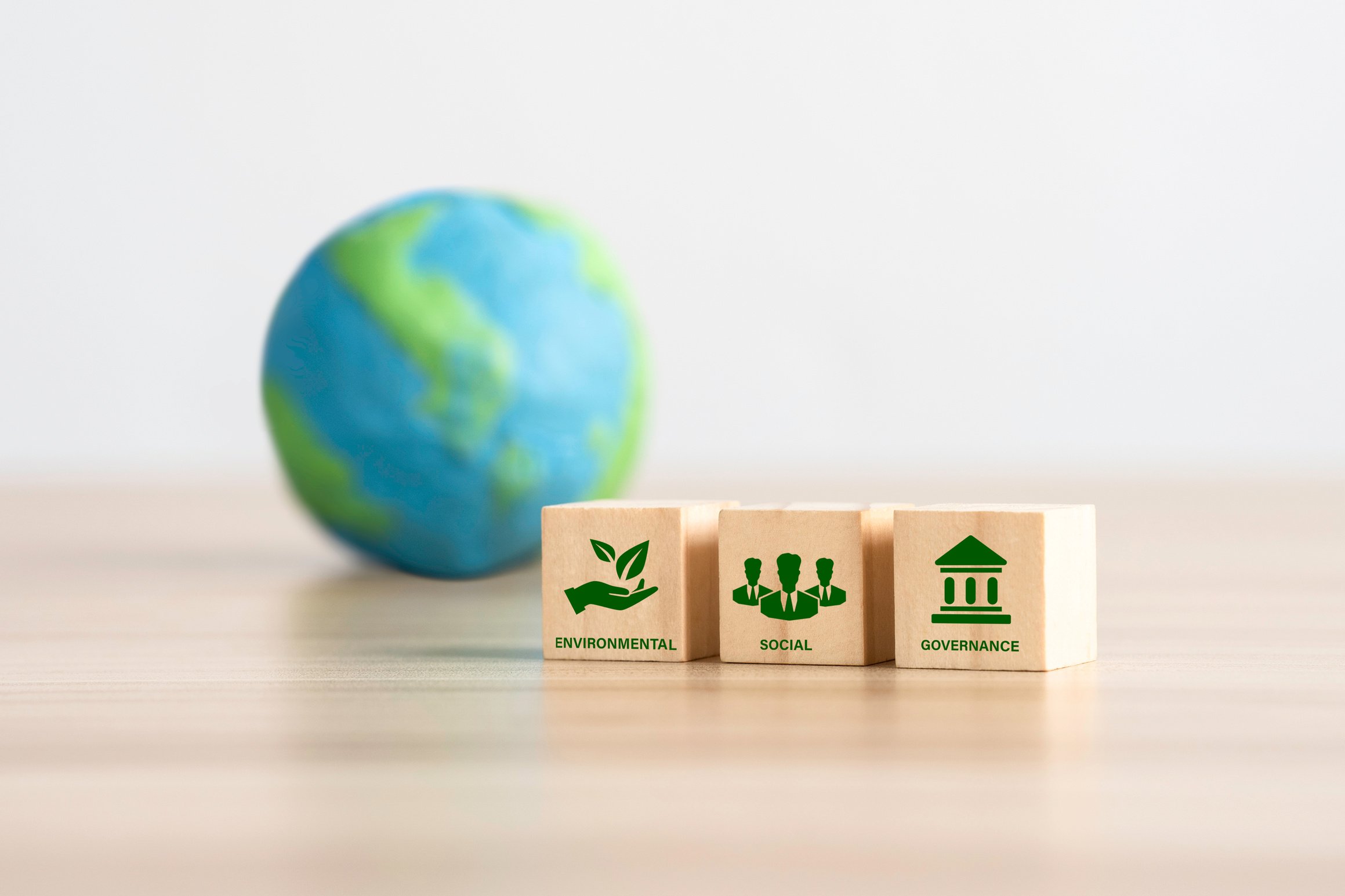 ESG icon on wooden cubes for Environment Social and Governance, sustainable organizational development Sustainable corporation development.World sustainable environment concept.